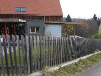 Haus mit Lärchenholz-Fassade, unbehandelt